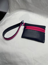 Load image into Gallery viewer, Handmade zipper pouch in navy vinyl with hot pink zipper and wristlet strap
